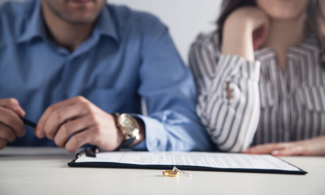 couple in front of divorce paperwork