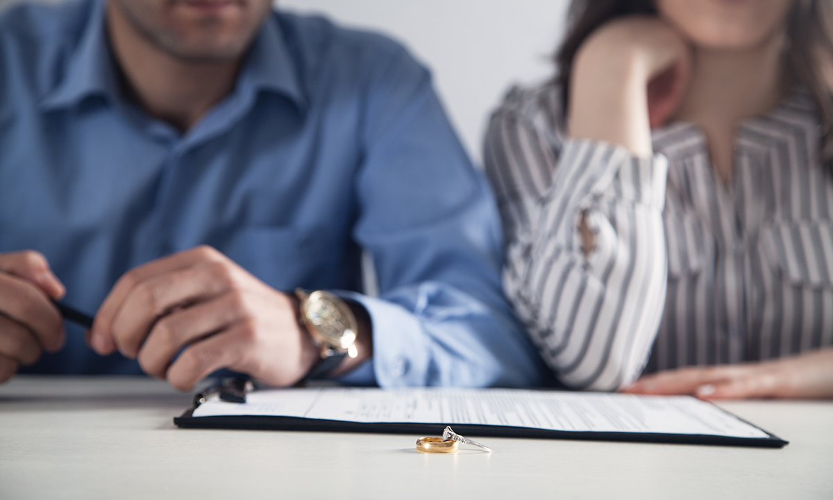 couple in front of divorce paperwork