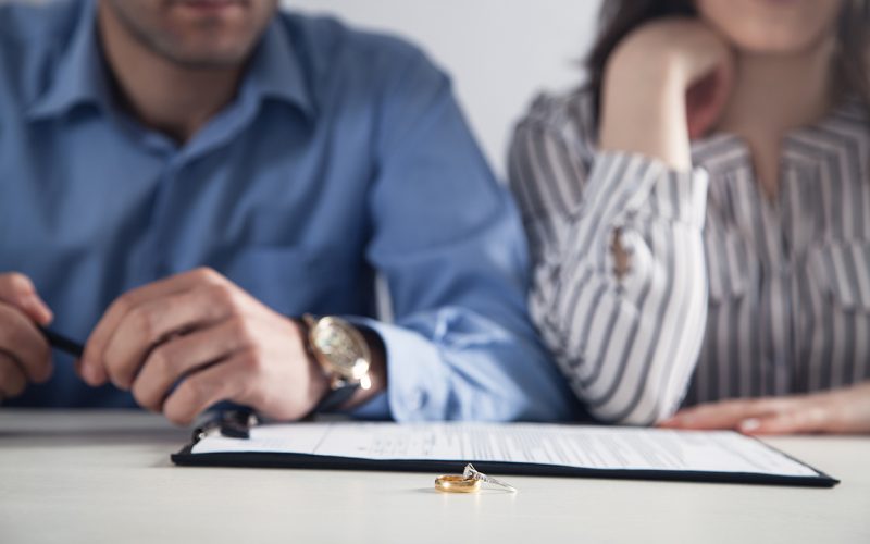 couple in front of divorce paperwork